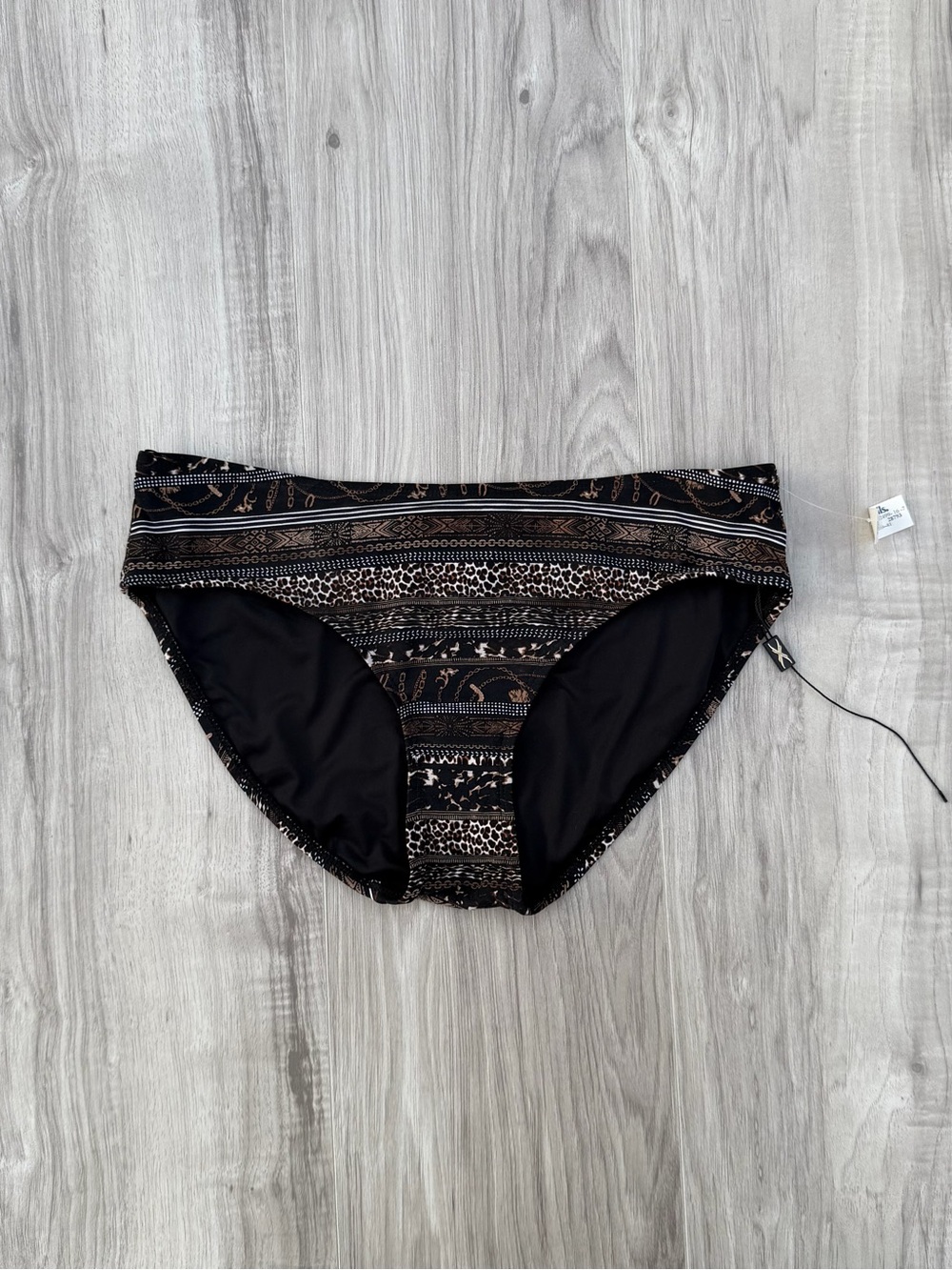 Nip Tuck Swim bikini bottoms feature a multi-patterned design